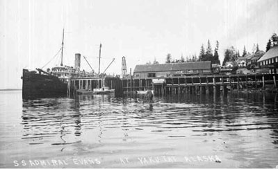 This picture postcard shows the S.S. Admiral Evans docked at Yukutat, Alaska, in 1923. Thirteen years earlier, the Admiral Evans, then known as the S.S. Buckman, was the subject of a remarkably maladroit attempt at piracy off the Oregon Coast. The passenger liner Admiral Evans, formerly the S.S. Buckman, docked at Yukutat, Alaska, in 1923.